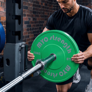 MYO Strength 10kg Olympic coloured bumper plate being loaded onto a barbell