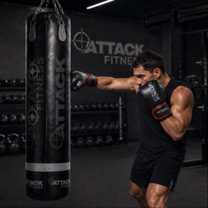 Person training with Attack Fitness leather boxing gloves on a punch bag